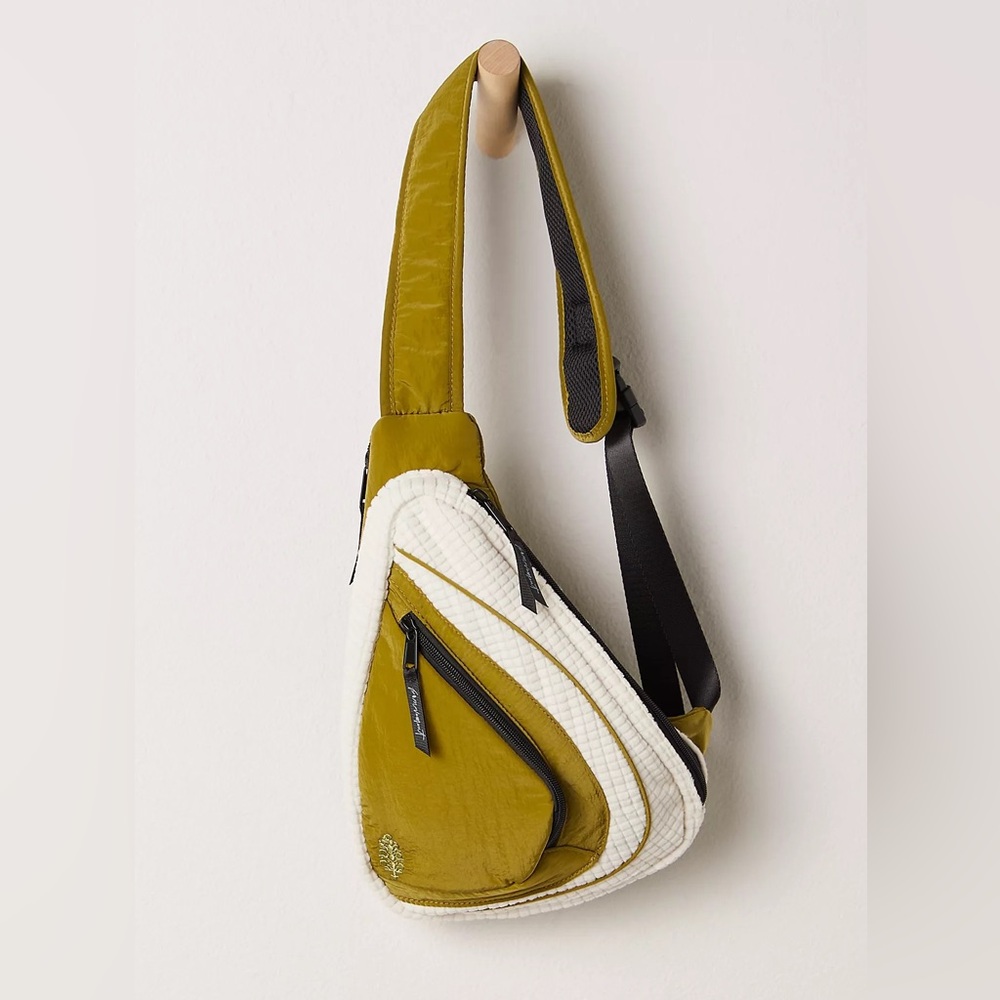 sold NWT Free People Movement green cold shoulder sling bag